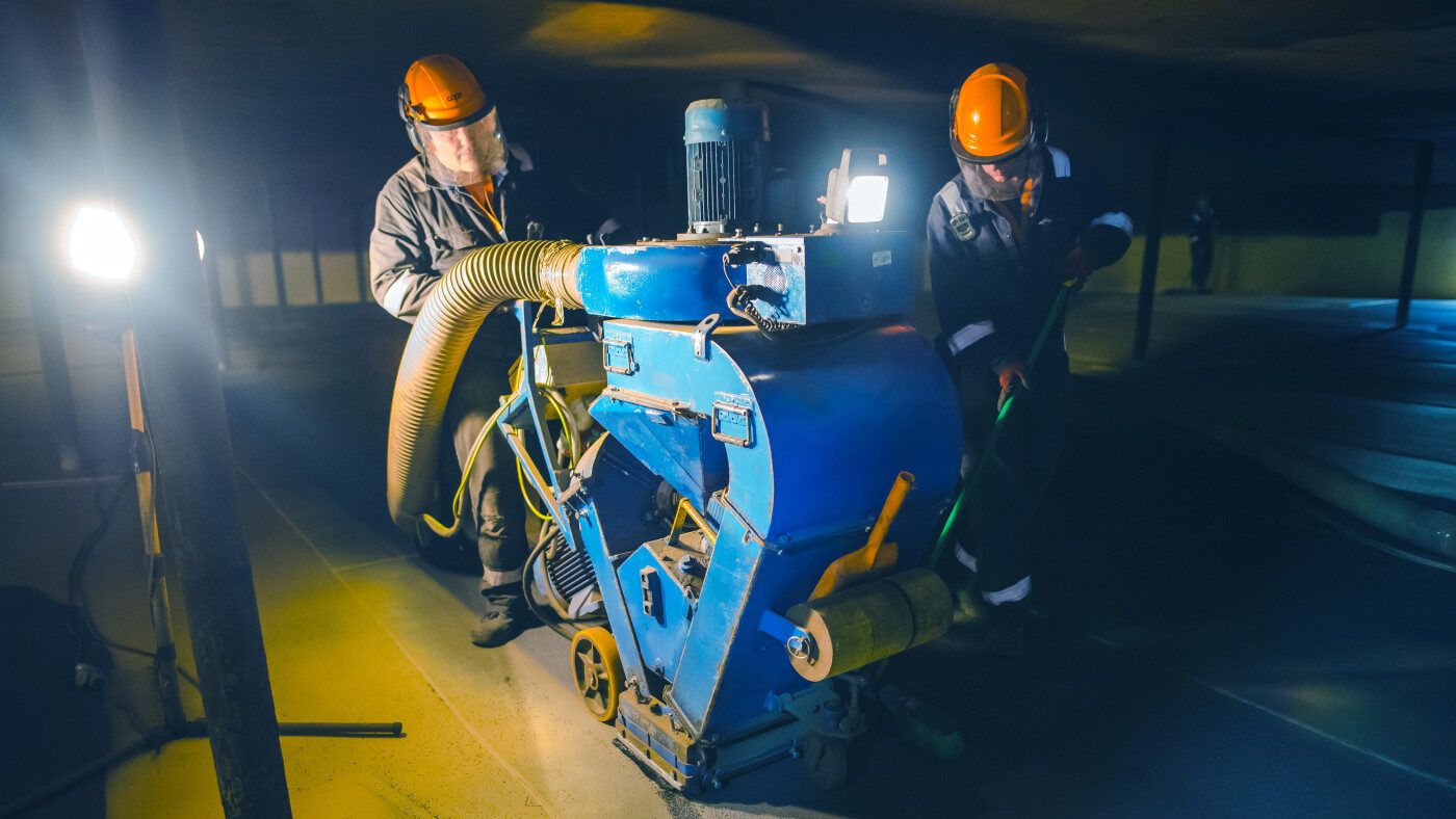 SPE 20" shot blaster removing contaminants and profiling a oil tank floor